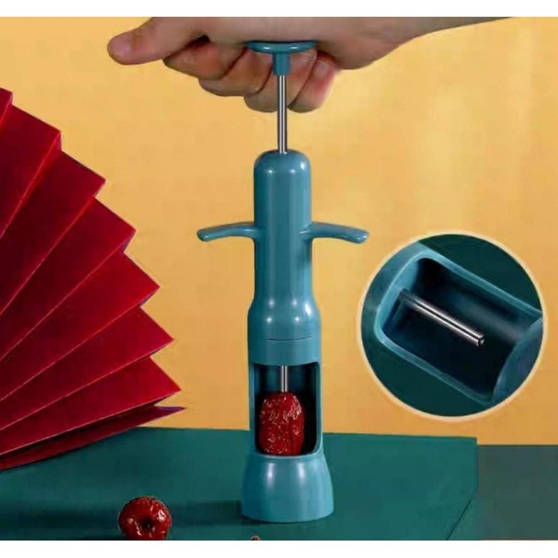 آلة يدوية لإزالة النواة ( البذرة ) من الزيتون والتمور