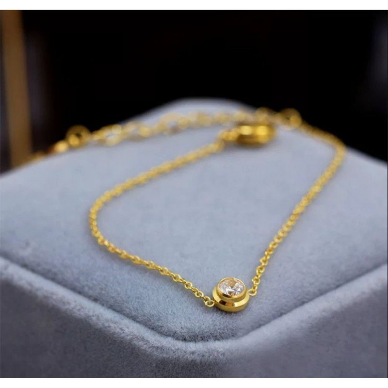 سوار ذهبي مع حجر زركون أبيض ناعم