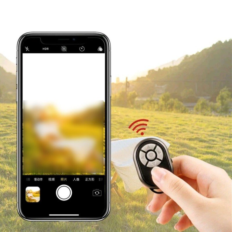 جهاز تحكم عن بعد للهاتف المحمول حجم صغير يعمل بالبلوتوث يمكن استخدامه لالتقاط الصور ومقاطع الفيديو أو للتنقل بين التطبيقات أو الألعاب