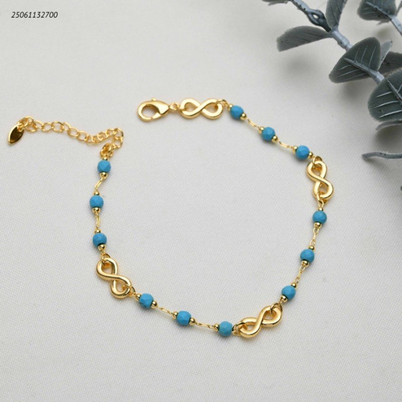 خلخال مع خرز بلون أزرق و شكل انفنتي لون ذهبي