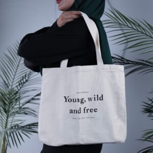 شنطة كتف لون بيج تصميم grow through young . Wild and free