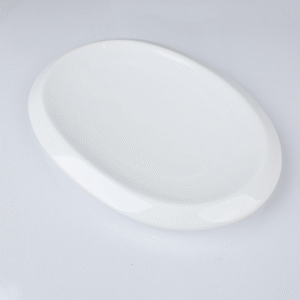 صحن بورسلان بتصميم بيضاوي حجم 31×21.5 سم لون أبيض