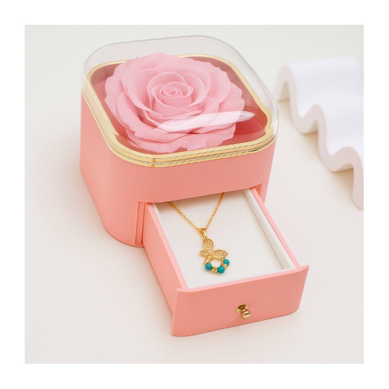 صندوق هدايا للمجوهرات زهري وذهبي مع ورد زهري