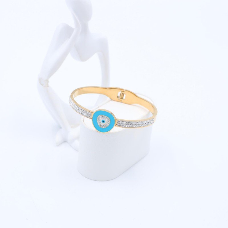 سوار لون ذهبي بتصميم عين لزن أزرق وزركون فضي