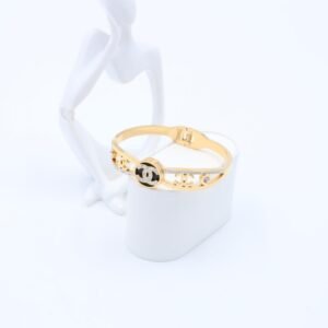 سوار لون ذهبي مع تفاصيل أسود وزركون فضي