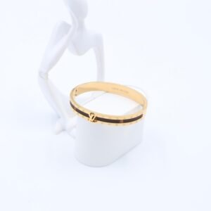 سوار لون ذهبي مع جلد بني