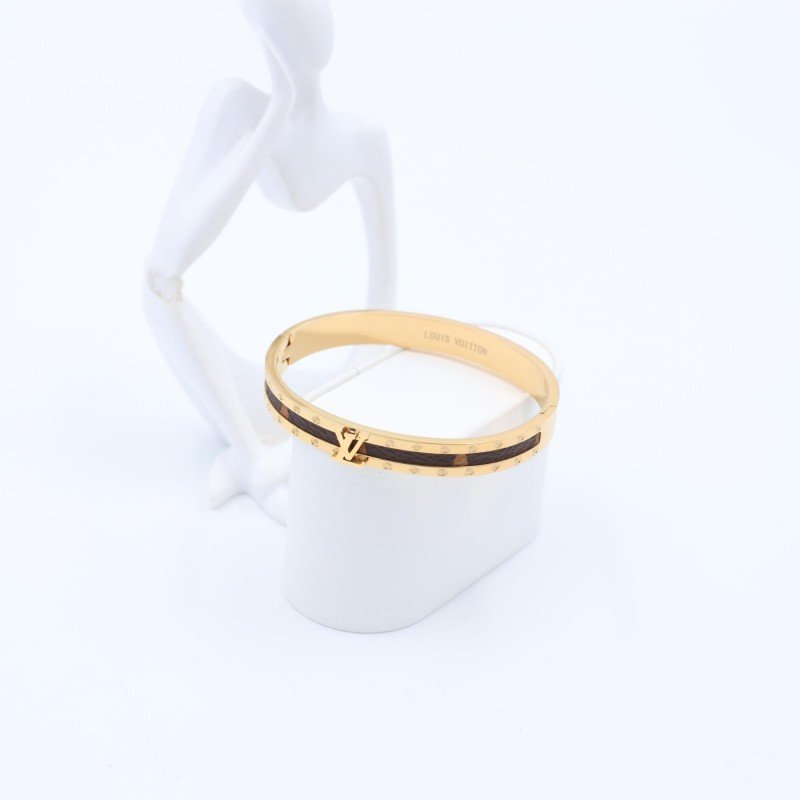 سوار لون ذهبي مع جلد بني