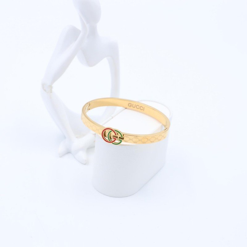 سوار لون ذهبي بتفاصيل أحمر وأخضر