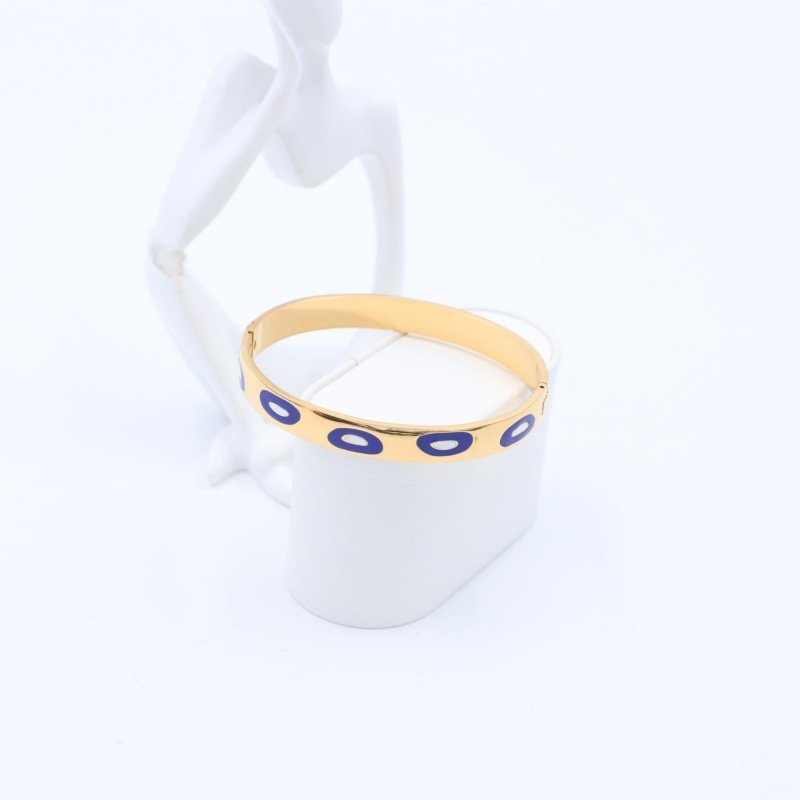 سوارعريض لون ذهبي بتصميم عيون أزرق